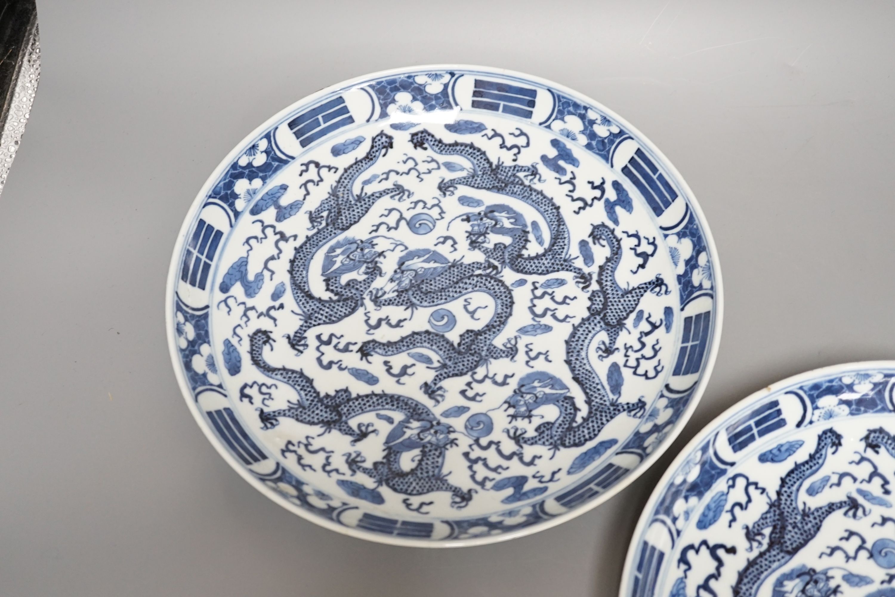 A pair of Chinese blue and white ‘dragon’ dishes, Qing dynasty, 27cm diameter